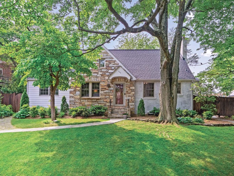 A house with green front yard and trees