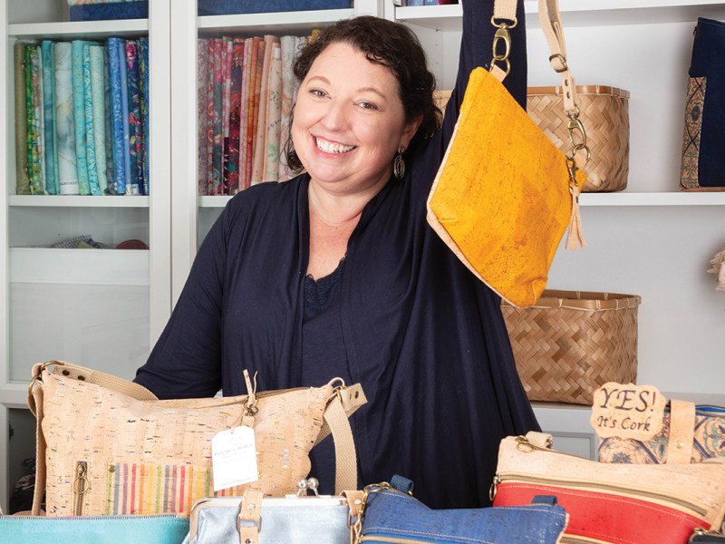 Kristina Huddle shows off her cork bags.