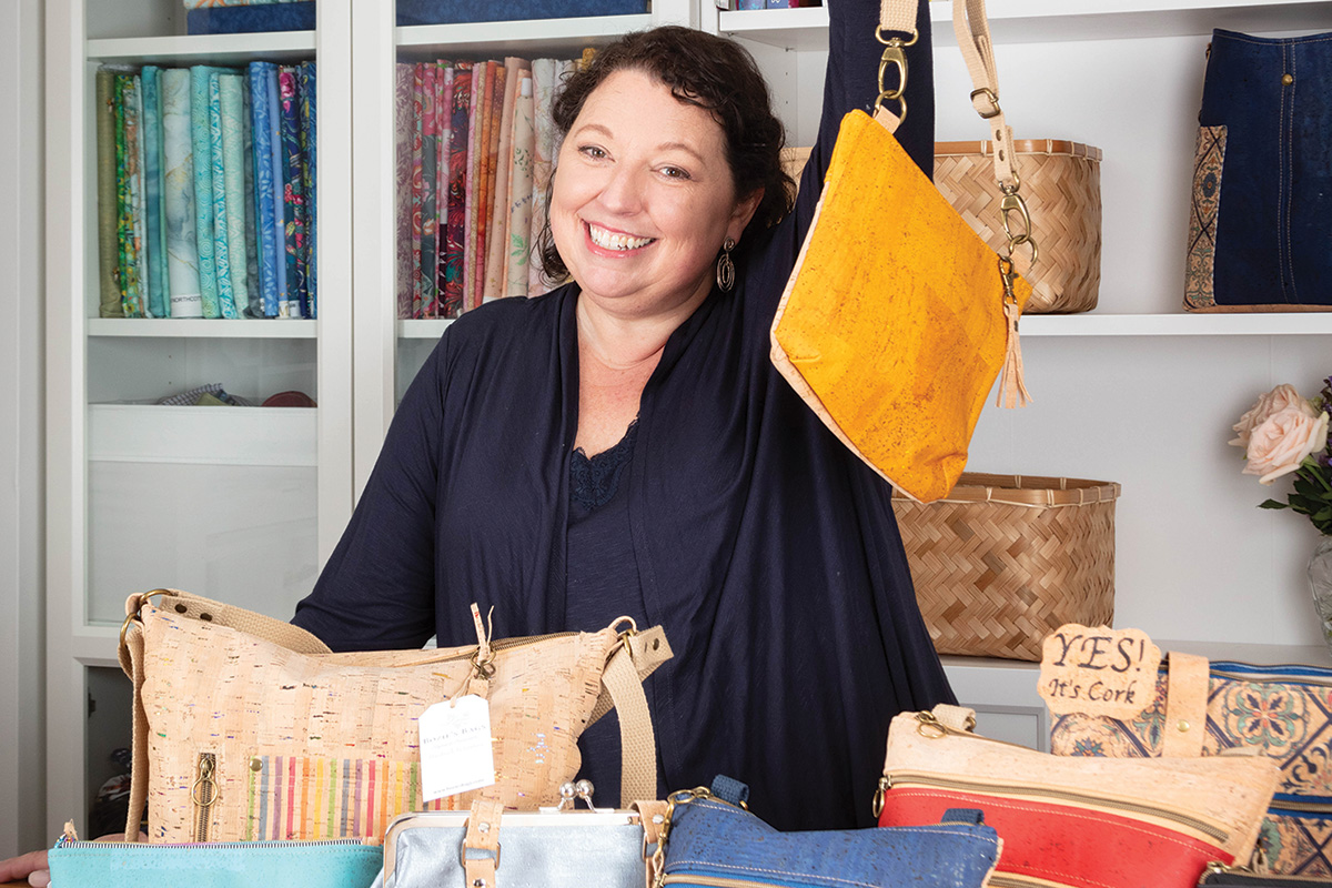 Kristina Huddle shows off her cork bags.