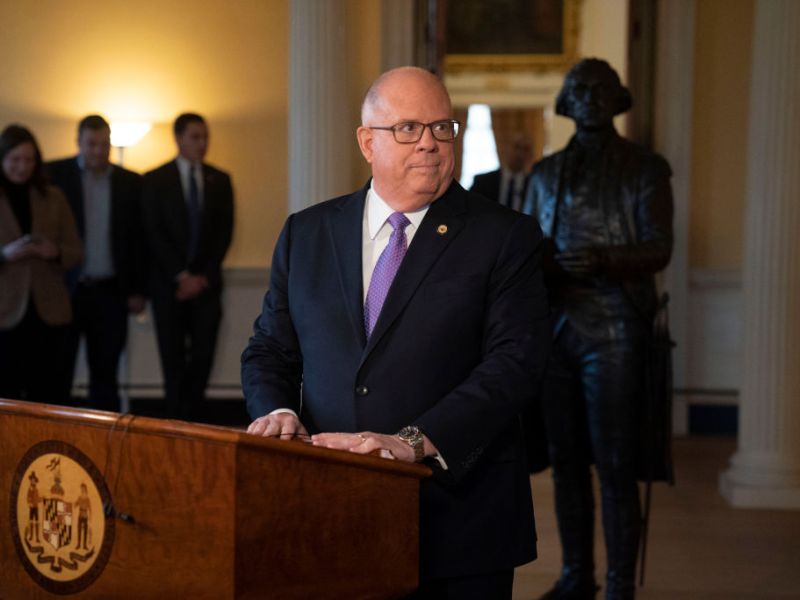 A suited man at a podium.