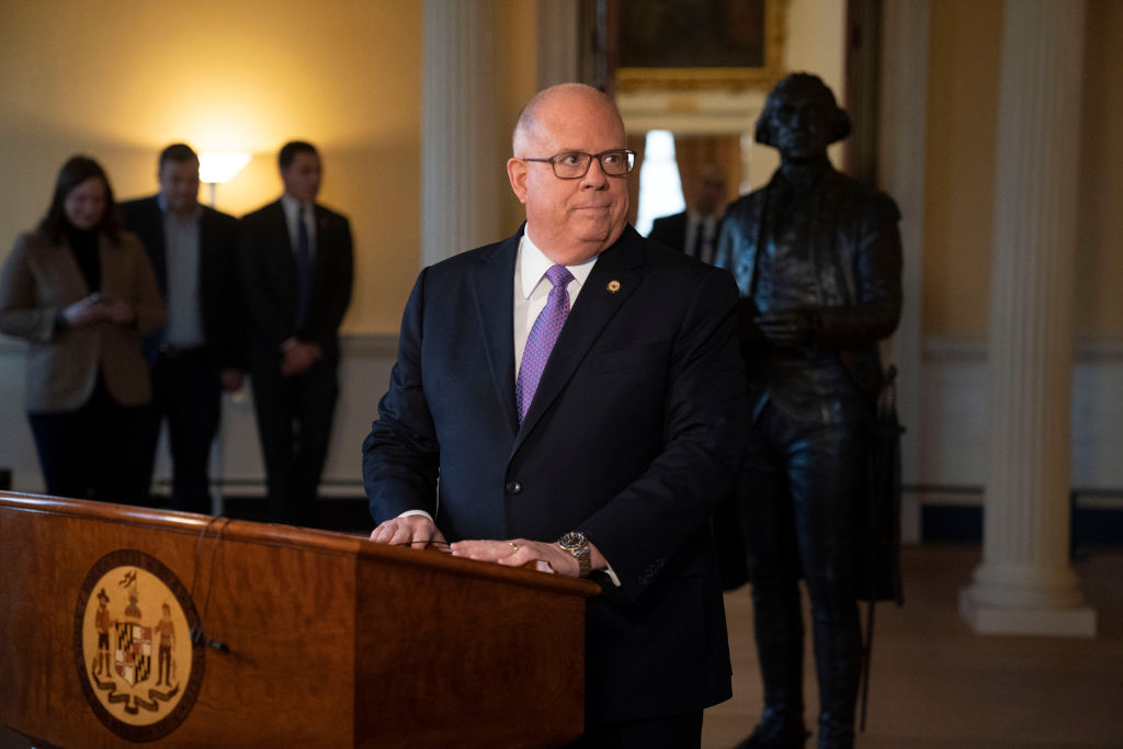 A suited man at a podium.