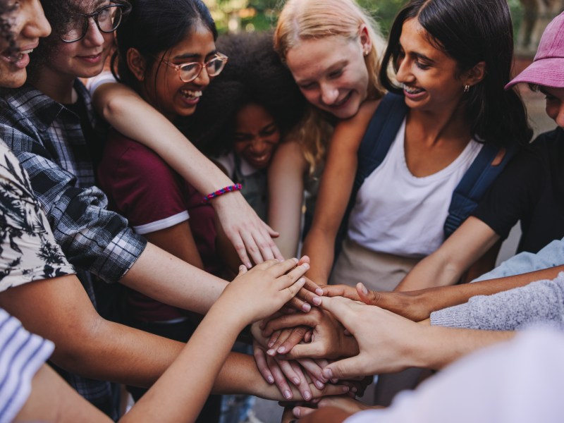 Group of girls joining hands