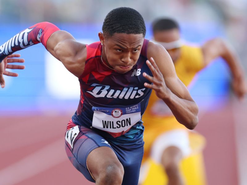 a runner with an outfit that says Bullis and a bib that says Wilson