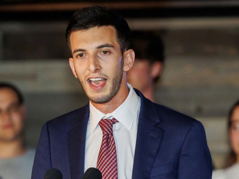 a man in a suit speaking