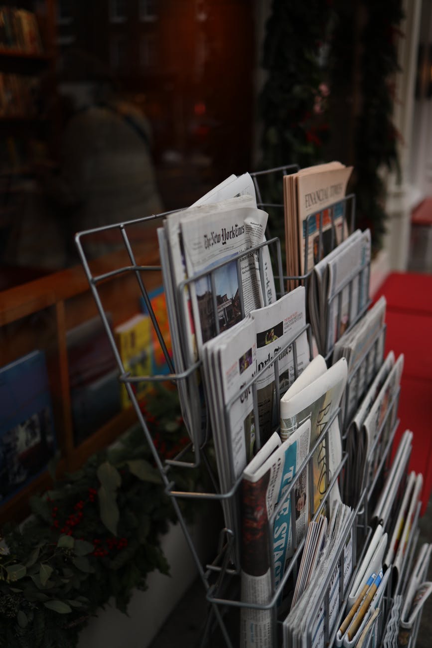 newspapers on the metal rack