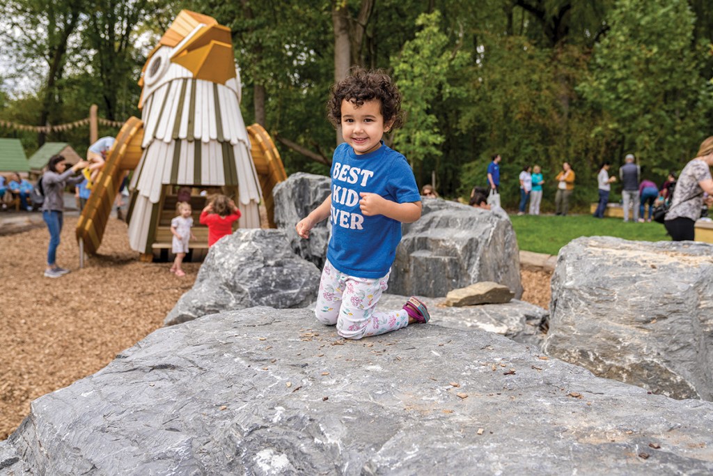 Having fun at the Nature Play Space at Woodend Nature Sanctuary in Chevy Chase